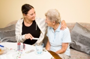 Elderly lady with carer