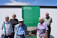 Judith Wolton, TDC’s Jaywick Sands Neighbourhood Manager Teresa Enys, Neville Sisson, Pam Stevens and William Stevens with one of the hoardings.